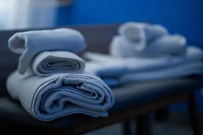 a pile of towels sitting on top of a table at RhelizeOne & Spa جميل in Palermo