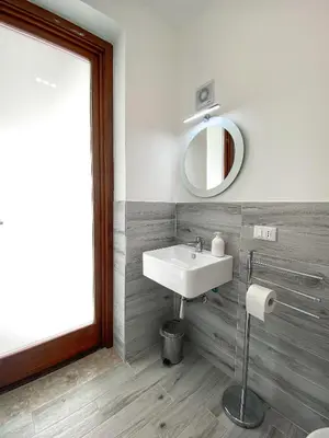 a bathroom with a sink and a mirror at A Cantunera in San Vito lo Capo