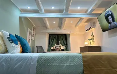 a bedroom with a large bed and a window at Casa Elivì Ballaró 2 passi dal centro storico, parcheggio e stazione ferroviaria in Palermo