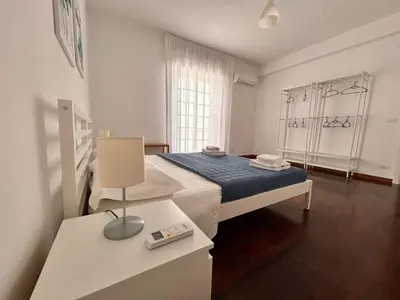 a hospital room with a bed and a table at Casavacanze nel blu Maestrale in Isola delle Femmine