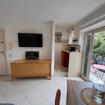 a living room with a flat screen tv on a wall at Casa Khalesia in Palermo
