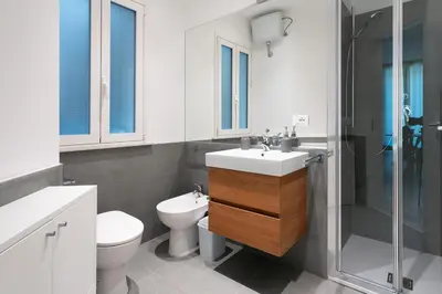 a bathroom with a toilet and a sink and a shower at Dimora Florio in Palermo