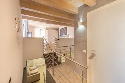 a view of a staircase in a house with wooden ceilings at La mia deliziosa Casetta di giù in Termini Imerese