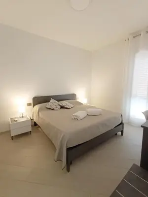 a bedroom with a bed with two towels on it at Casa Marinaro in Castellammare del Golfo