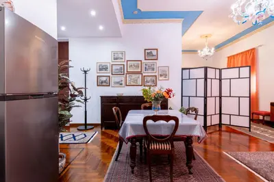 a dining room with a table and chairs at Stabile 16 Apartment in Palermo