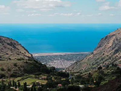 a view of the ocean from between two mountains at Conte125 in Cinisi