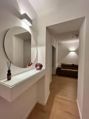 a living room with a mirror on the wall at La Casetta delle Strelizie in Palermo