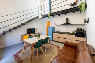 a living room with a couch and a table at Mondello 2C casa vacanze in Palermo