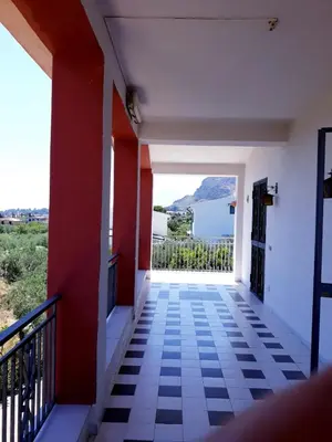 a room with a balcony with a view of the ocean at Casa vacanze zina in Altavilla Milicia