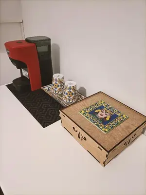 a table with a sewing machine and a box at Thalia in Palermo