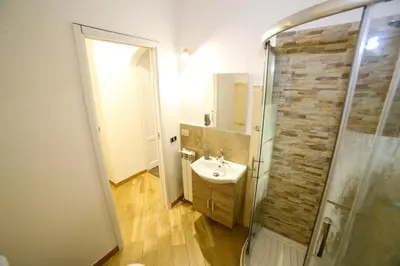 a bathroom with a sink and a shower at Thalia in Palermo