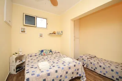 a small bedroom with a bed and a tv at La casa di Jack in Bagheria