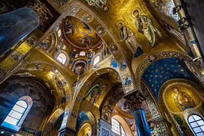 a church with ornate ceilings and paintings on it at La Porta dei Mori in Palermo