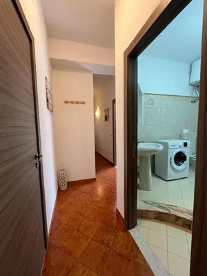 a bathroom with a washing machine and a washer and dryer at Casa Vacanza Randazzo in Trappeto