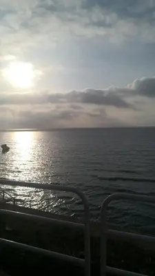 a view of the ocean with a boat in the water at Holiday House Lady in Terrasini