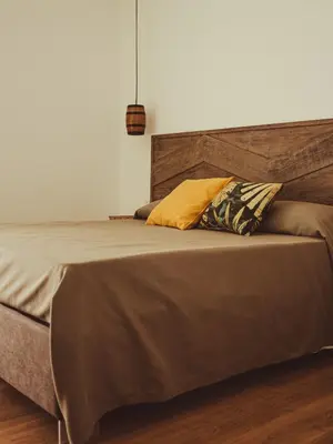 a bed with two pillows on it in a bedroom at U Zuccareddu in Alcamo