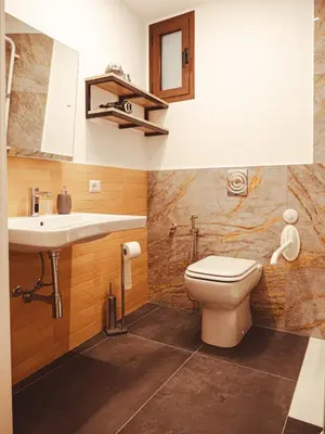 a bathroom with a toilet and a sink at U Zuccareddu in Alcamo
