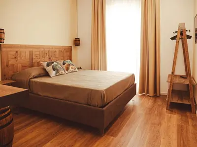 a bedroom with a bed and a ladder and a tripod at U Zuccareddu in Alcamo