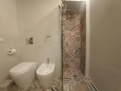 a bathroom with a toilet and a shower at PalermHost in Palermo