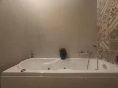 a bath tub with a plant sitting on top of it at PalermHost in Palermo