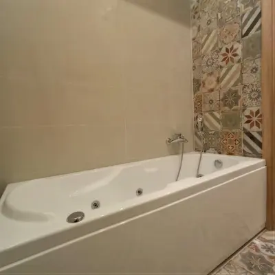 a white bath tub in a bathroom at PalermHost in Palermo