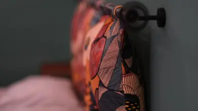 a close up of a tie hanging on a wall at Le Radici casa vacanze in Palermo