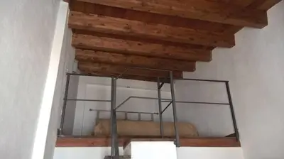 a glass shelf in a room with a wooden ceiling at Vecchio Cortile Home Holidays in Palermo