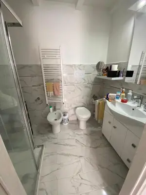 a bathroom with a shower and a toilet and a sink at Casa vacanza solemare in Balestrate
