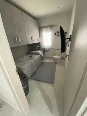 a small bedroom with a bed and a window at Casa vacanza solemare in Balestrate