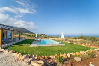 a yard with a pool and a house at Villa Majestatis in Scopello