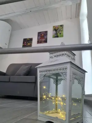 a white cabinet with lights in a living room at Casetta Bella Nonna Rosetta in Mondello