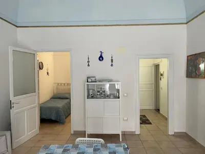 a living room with a room with a bed at Casa Vacanza Sicilia Dolce Mare in Balestrate