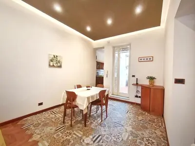 a dining room with a table and chairs at Annacati House Centro Storico in Palermo