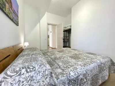 a bedroom with a bed in a white room at Alka Home, 7 km dal mare in Alcamo