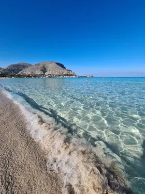 a view of the ocean from the shore at Àrima Mondello Apartment in Mondello