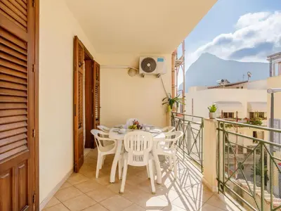 a balcony with a table and chairs on it at Apartment Giardini Gaia by Interhome in San Vito lo Capo