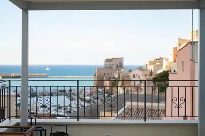 a balcony with a view of a parking lot at Casa vacanze Marinaro in Castellammare del Golfo