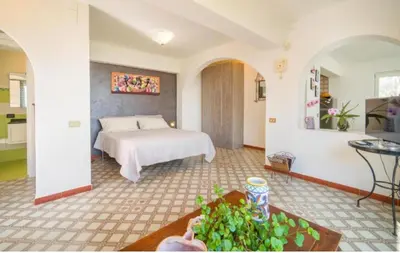 a bedroom with a bed in a room at La Conca D'Oro in Palermo