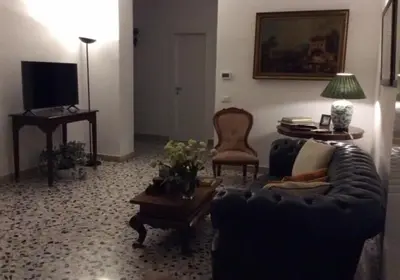 a living room with a couch and a table at Casa Marele in Palermo