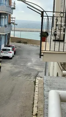 a parking lot with a view of the ocean at APPARTAMENTO MAESTRALE in Balestrate