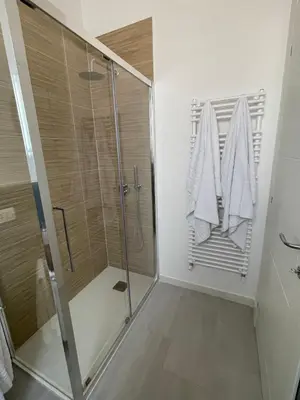 a shower in a bathroom with a glass shower stall at Martanna Rooms in Carini