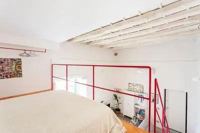 a bedroom with a bed and a glass wall at A casa di Simona in Palermo