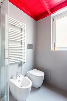 a white bathroom with a toilet and a sink at A casa di Simona in Palermo