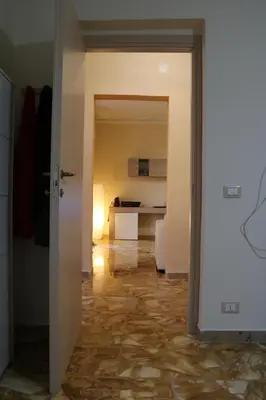 an open door to a room with a kitchen at Casa Vacanza Stella Maris in Isola delle Femmine