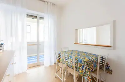 a bedroom with a bed and a table and a table at La Dimora dei Teatri, Luxury rooms in Palermo
