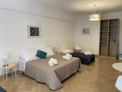 a room with a bed with a tripod and a light at La Dimora dei Teatri, Luxury rooms in Palermo