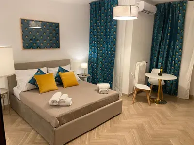 a bedroom with a large bed with towels on it at La Dimora dei Teatri, Luxury rooms in Palermo