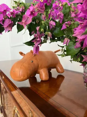 a vase filled with flowers on top of a table at Sunny Home in Palermo