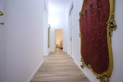 a hallway with a large mirror on a wall at Terre d'oro, appartamento di lusso in centro città in Palermo