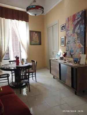 a kitchen and dining room with a table and a counter at La casa di Nanà in centro in Palermo